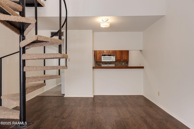 300 Lozes Ave Apt 1503, Lafayette, LA 70508 - staircase with wood finished floors and baseboards