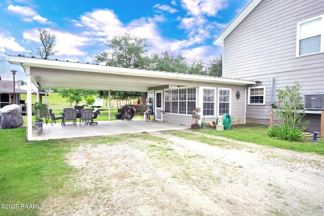 151 Hickory St, Port Barre, LA 70577 - back of property with cooling unit and a yard