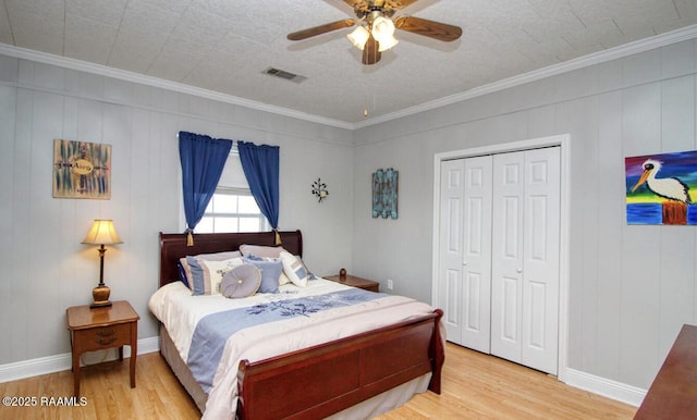 151 Hickory St, Port Barre, LA 70577 - bedroom featuring light wood-type flooring, ornamental molding, a closet, ceiling fan, and baseboards