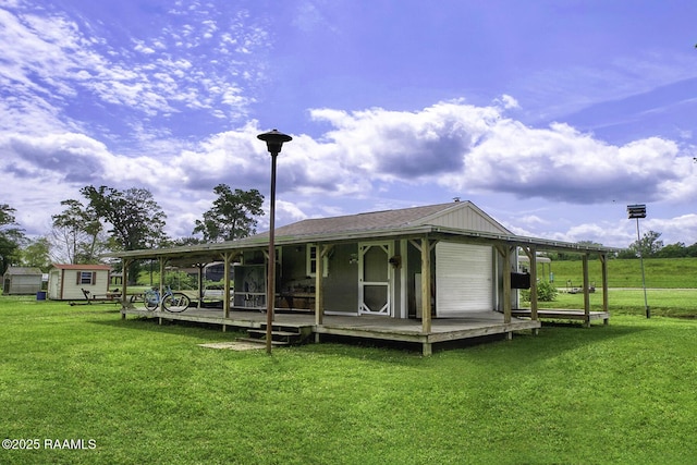 151 Hickory St, Port Barre, LA 70577 - back of property featuring a lawn and an outdoor structure