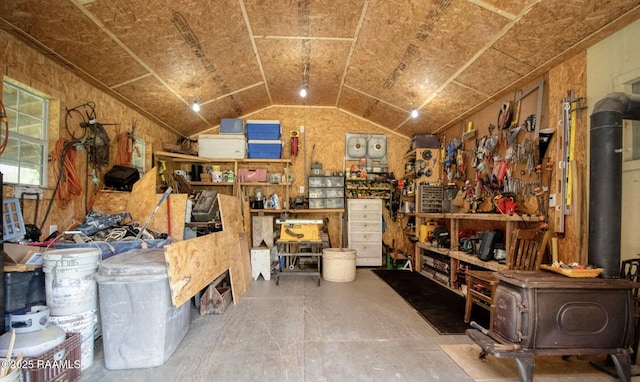 151 Hickory St, Port Barre, LA 70577 - miscellaneous room featuring a wood stove, lofted ceiling, and a workshop area