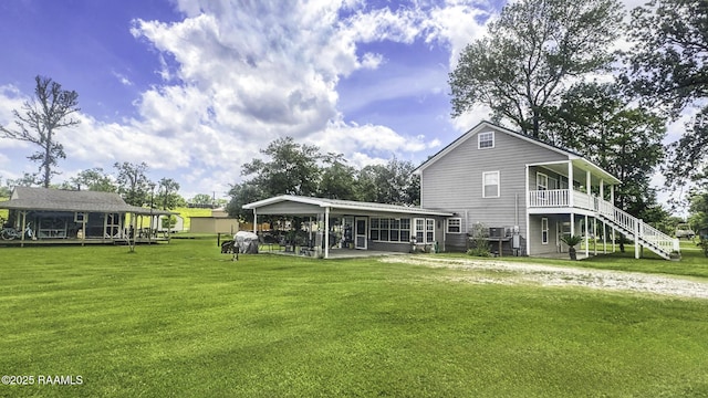 151 Hickory St, Port Barre, LA 70577 - rear view of house featuring a yard and stairway