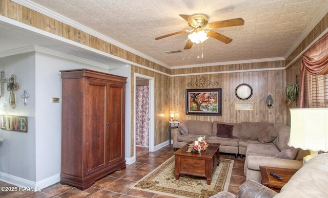 151 Hickory St, Port Barre, LA 70577 - living room with ceiling fan, baseboards, ornamental molding, and dark tile patterned floors