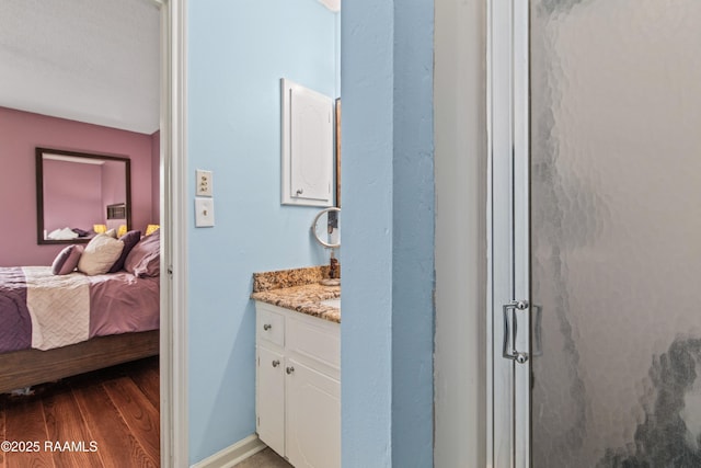 315 Creswell Ave, Scott, LA 70583 - full bath with vanity, wood finished floors, a stall shower, ensuite bath, and baseboards