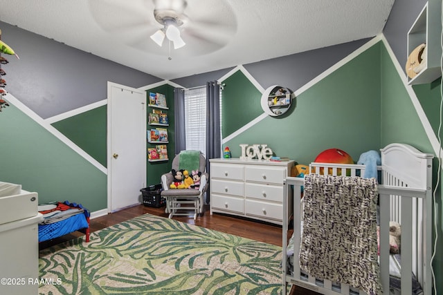 315 Creswell Ave, Scott, LA 70583 - bedroom featuring wood finished floors, a crib, and a ceiling fan