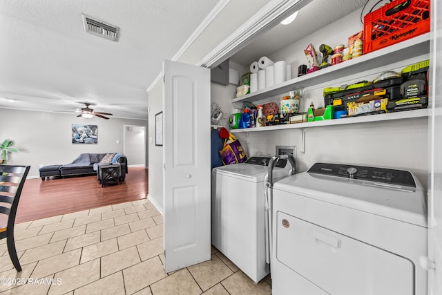 315 Creswell Ave, Scott, LA 70583 - laundry area with independent washer and dryer, light tile patterned floors, ceiling fan, and a textured ceiling