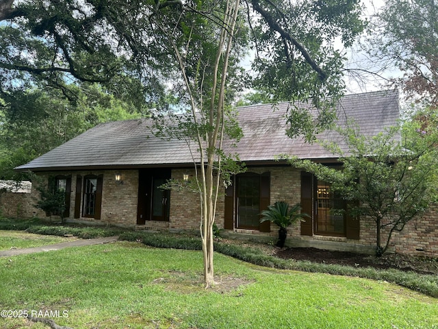 421 Lippi Blvd, Lafayette, LA 70508 - view of front facade with a front lawn and brick siding