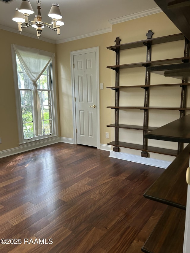 421 Lippi Blvd, Lafayette, LA 70508 - unfurnished dining area featuring ornamental molding, a chandelier, baseboards, and wood finished floors
