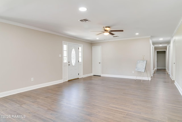 1010 Domingue St, Breaux Bridge, LA 70517 - foyer featuring a ceiling fan, ornamental molding, recessed lighting, and wood finished floors