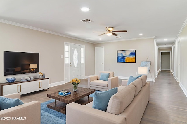 1010 Domingue St, Breaux Bridge, LA 70517 - living room featuring wood finished floors, a ceiling fan, ornamental molding, and recessed lighting