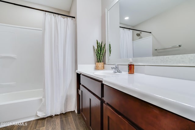 1010 Domingue St, Breaux Bridge, LA 70517 - full bathroom featuring vanity, shower / bath combo, and wood finished floors