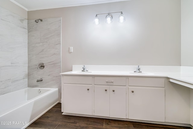1010 Domingue St, Breaux Bridge, LA 70517 - bathroom featuring shower / bath combination, double vanity, wood finished floors, and ornamental molding