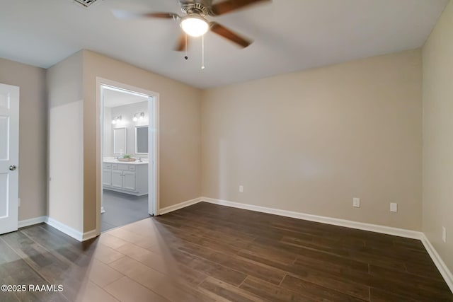1010 Domingue St, Breaux Bridge, LA 70517 - empty room with dark wood finished floors and ceiling fan