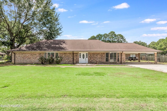 1010 Domingue St, Breaux Bridge, LA 70517 - ranch-style home with concrete driveway, a carport, brick siding, and roof with shingles