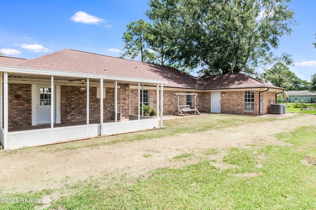 1010 Domingue St, Breaux Bridge, LA 70517 - back of property featuring brick siding and a yard