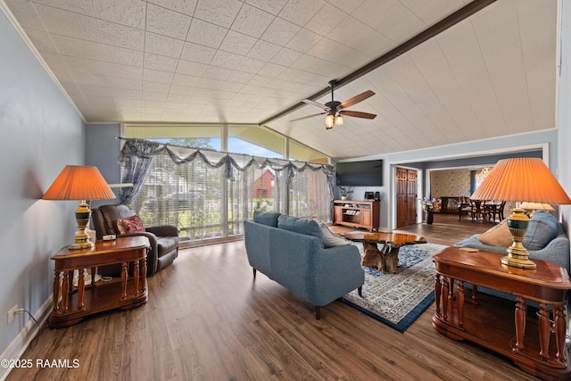 630 W Peach Ave, Eunice, LA 70535 - living room featuring wood finished floors, a ceiling fan, baseboards, vaulted ceiling, and crown molding