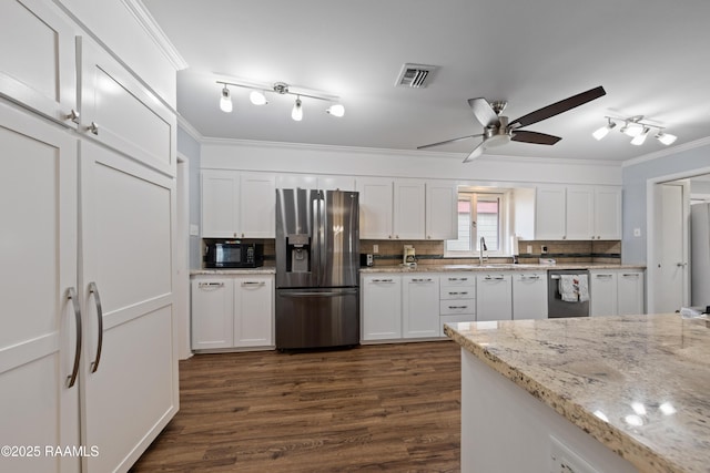 630 W Peach Ave, Eunice, LA 70535 - kitchen featuring stainless steel appliances, ornamental molding, a ceiling fan, white cabinets, and dark wood-type flooring