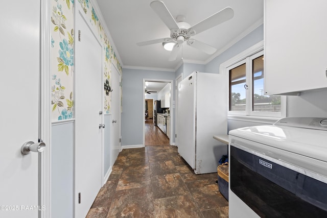630 W Peach Ave, Eunice, LA 70535 - washroom featuring washer / clothes dryer, cabinet space, dark stone finish flooring, baseboards, and crown molding
