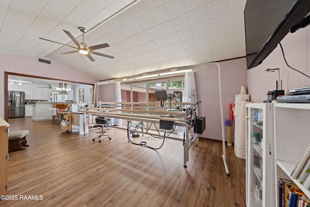 630 W Peach Ave, Eunice, LA 70535 - home office with a ceiling fan, wood finished floors, vaulted ceiling, and a chandelier