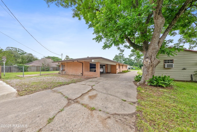 630 W Peach Ave, Eunice, LA 70535 - view of front of home with concrete driveway and cooling unit