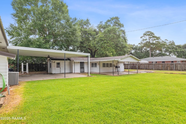 407 N Hebert Ave, Kaplan, LA 70548 - rear view of property with central air condition unit, a carport, and a patio