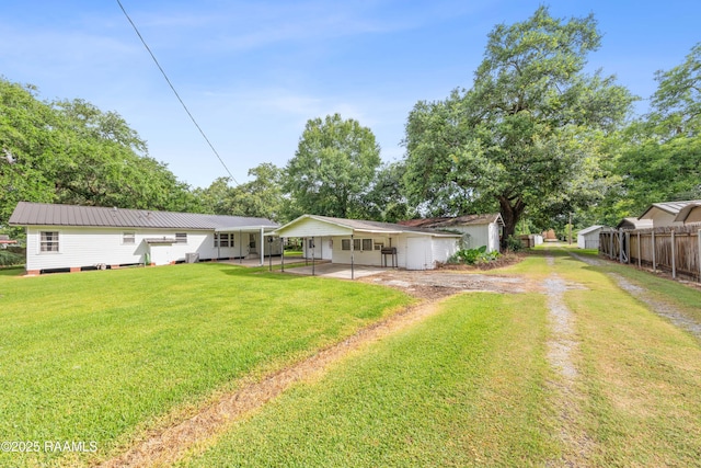 407 N Hebert Ave, Kaplan, LA 70548 - view of yard with a carport and driveway