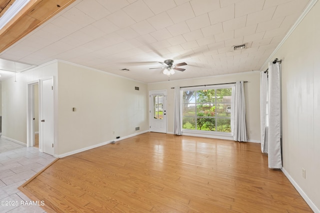 407 N Hebert Ave, Kaplan, LA 70548 - spare room featuring ornamental molding, attic access, ceiling fan, and baseboards