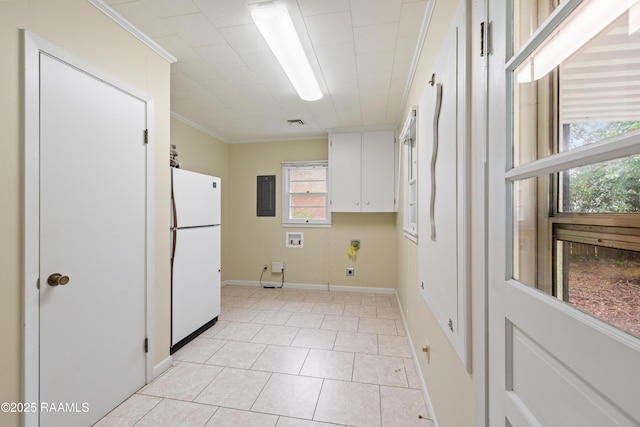 407 N Hebert Ave, Kaplan, LA 70548 - laundry room with ornamental molding, electric panel, healthy amount of natural light, washer hookup, and cabinet space