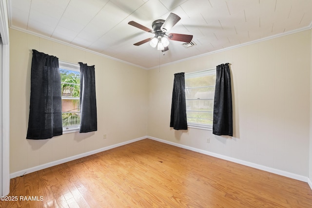 407 N Hebert Ave, Kaplan, LA 70548 - empty room with wood finished floors, ornamental molding, ceiling fan, and baseboards