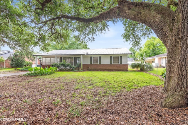 407 N Hebert Ave, Kaplan, LA 70548 - single story home featuring brick siding, an attached carport, and metal roof
