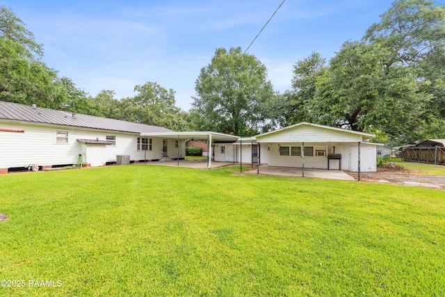 407 N Hebert Ave, Kaplan, LA 70548 - rear view of property featuring a lawn and central AC unit
