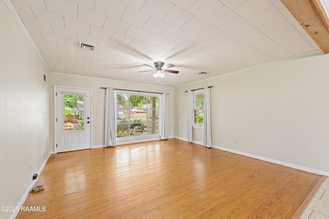 407 N Hebert Ave, Kaplan, LA 70548 - spare room featuring crown molding, ceiling fan, light wood-style floors, and baseboards