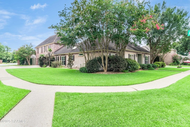 101 Hanover Sq, Lafayette, LA 70508 - view of front of house featuring a front lawn