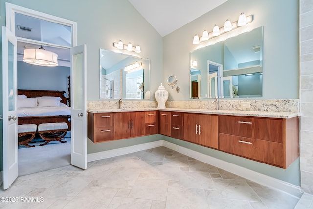 101 Hanover Sq, Lafayette, LA 70508 - ensuite bathroom featuring lofted ceiling and double vanity