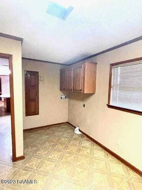 1944 Mills St, Scott, LA 70583 - below grade area featuring ornamental molding, baseboards, and light flooring