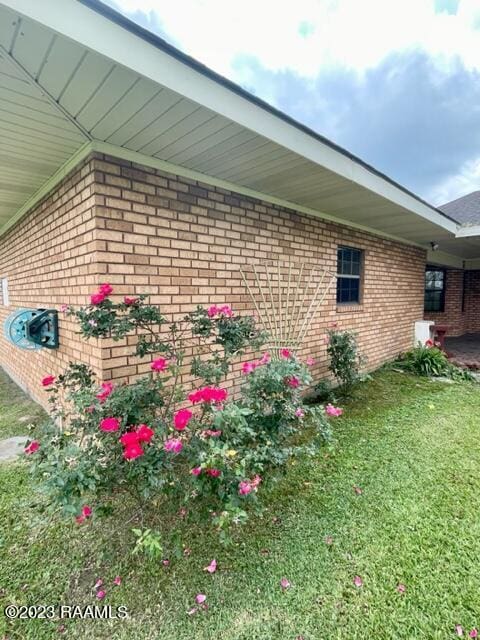 1944 Mills St, Scott, LA 70583 - view of side of property featuring brick siding and a lawn