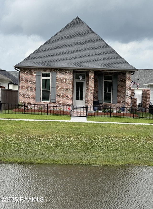 311 Villager Ave Unit C, Scott, LA 70583 - view of front facade featuring roof with shingles, brick siding, and a water view
