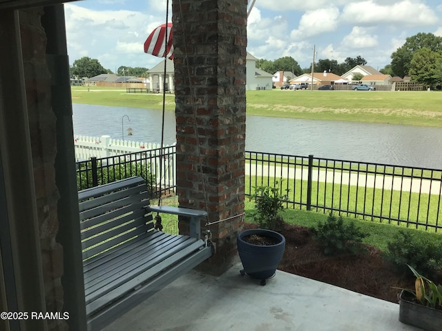 311 Villager Ave Unit C, Scott, LA 70583 - view of patio / terrace featuring a water view