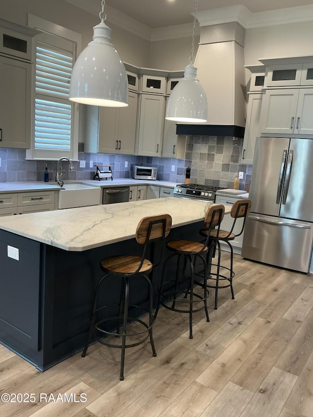 311 Villager Ave Unit C, Scott, LA 70583 - kitchen featuring appliances with stainless steel finishes, crown molding, a sink, backsplash, and pendant lighting
