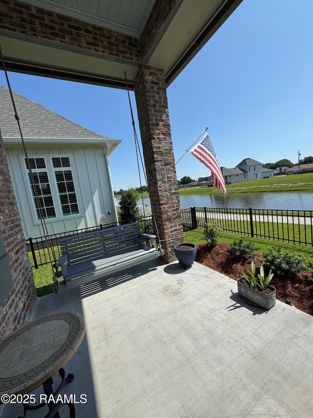 311 Villager Ave Unit C, Scott, LA 70583 - view of patio / terrace featuring a water view