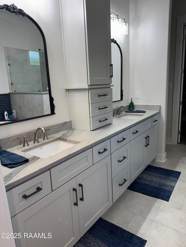 311 Villager Ave Unit C, Scott, LA 70583 - bathroom featuring double vanity and tiled shower