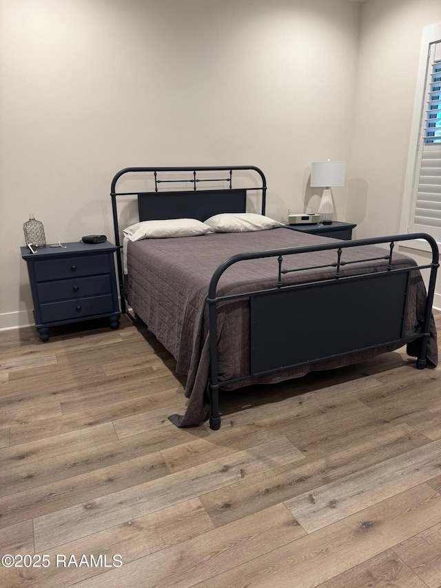 311 Villager Ave Unit C, Scott, LA 70583 - bedroom with wood finished floors and baseboards