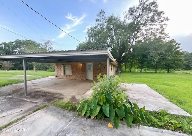 1101 Portage Rd, Arnaudville, LA 70512 - view of parking featuring an attached carport