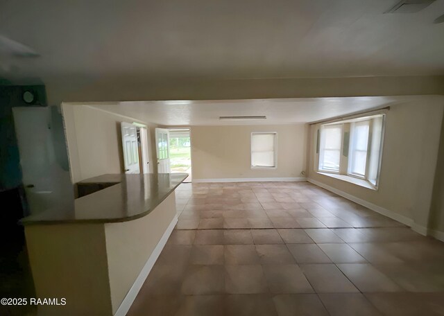 1101 Portage Rd, Arnaudville, LA 70512 - empty room featuring baseboards and light tile patterned flooring