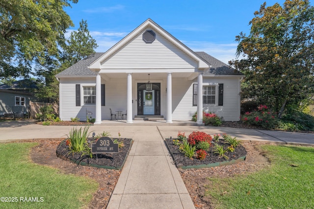 303 Duperier Ave, New Iberia, LA 70563 - greek revival inspired property featuring covered porch and roof with shingles