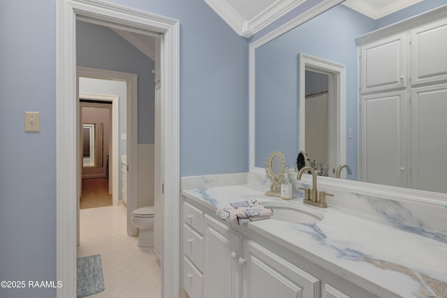 303 Duperier Ave, New Iberia, LA 70563 - full bath with vanity, toilet, ornamental molding, and tile patterned flooring