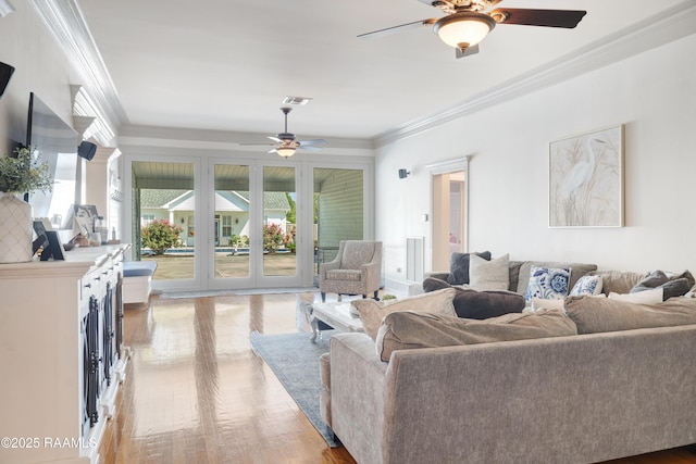 303 Duperier Ave, New Iberia, LA 70563 - living area featuring ceiling fan, ornamental molding, and light wood-style floors