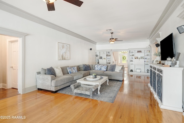 303 Duperier Ave, New Iberia, LA 70563 - living room with a ceiling fan, light wood-style floors, and ornamental molding