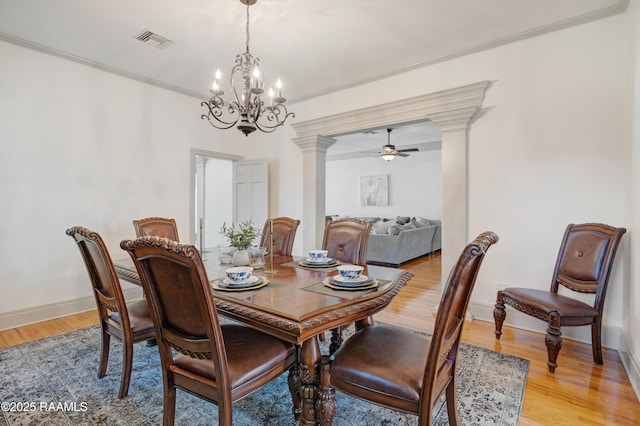 303 Duperier Ave, New Iberia, LA 70563 - dining space featuring decorative columns, crown molding, light wood finished floors, a chandelier, and ceiling fan