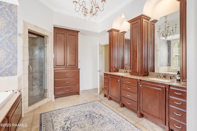 303 Duperier Ave, New Iberia, LA 70563 - bathroom with a chandelier, decorative columns, a shower stall, double vanity, and crown molding